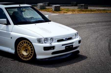 white cossi with gold wheels 