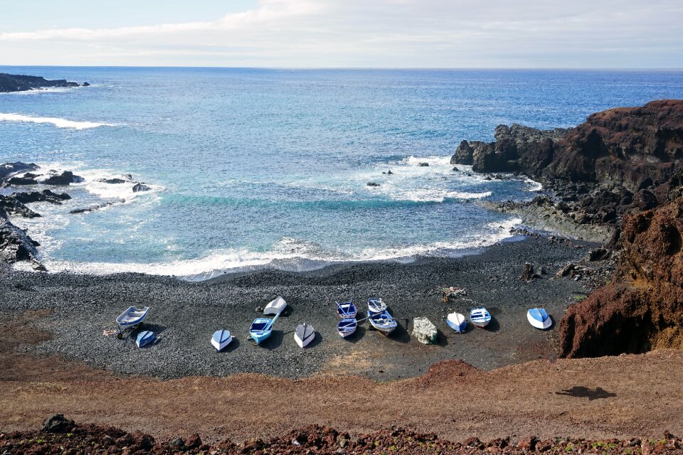 Boats bay ocean surf