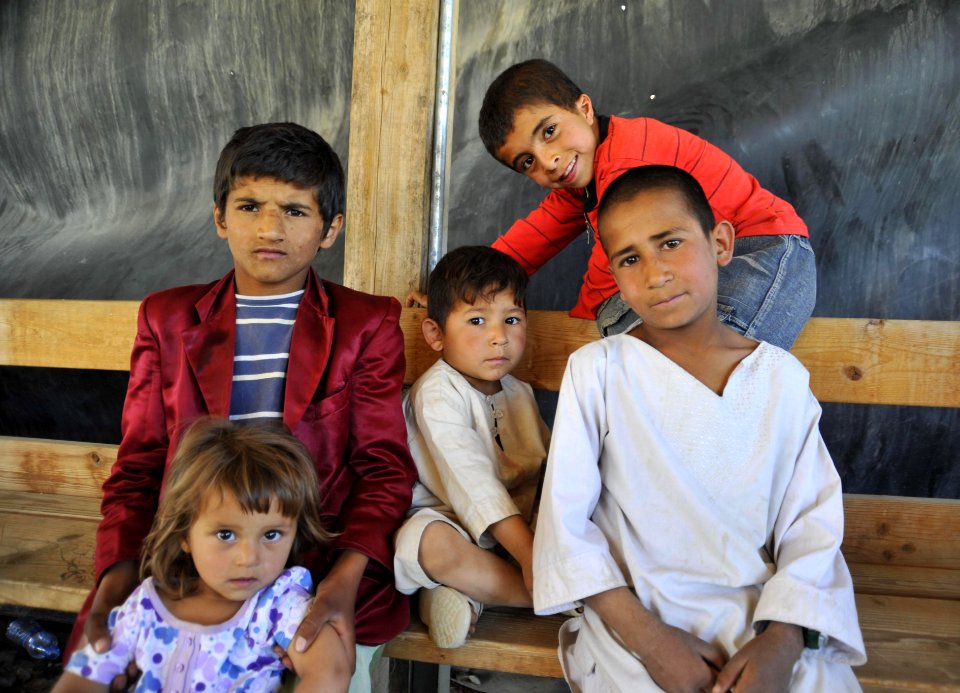 Afghan children in literacy program pose for a photo 