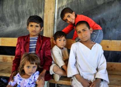 Afghan children in literacy program pose for a photo 