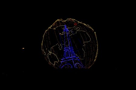 Image of Eiffel Tower With Illuminated Globe honors the CO… photo