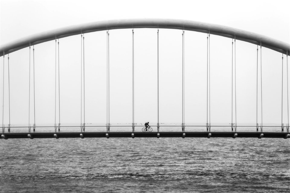 Bicycle riding on bridge photo