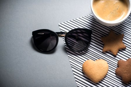 sun glasses with tea and biscuits 