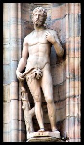 Adamo con il serpente, statua del Duomo di Milano photo