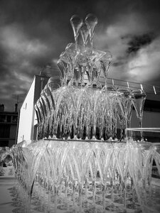 Glass pyramid champagne fountain black and white photo