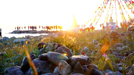 People prayer flags river