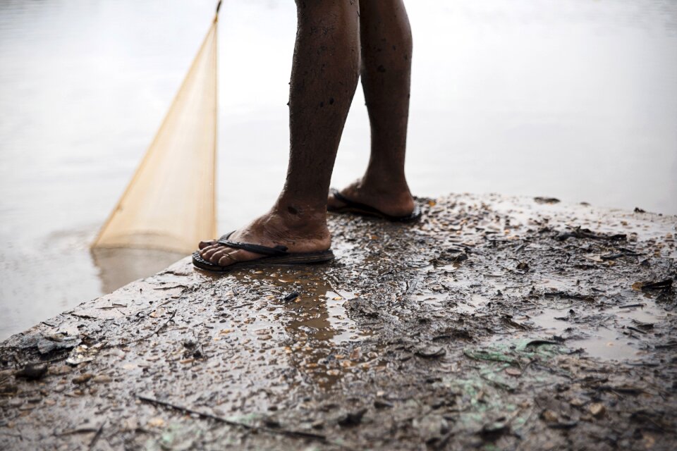 Fish net fishing man