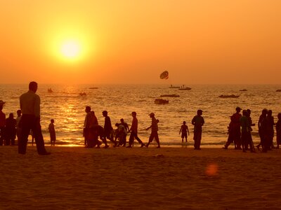 Beach orange sky people