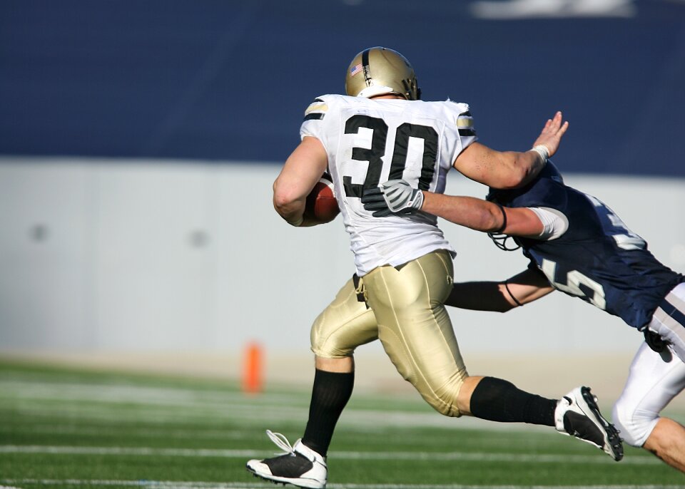 Runner tackle stiff arm