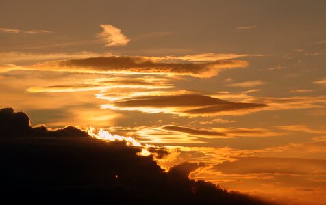 Evening sky setting sun clouds photo