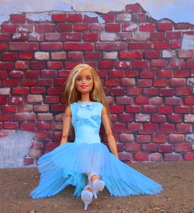 Sitting brick wall posing