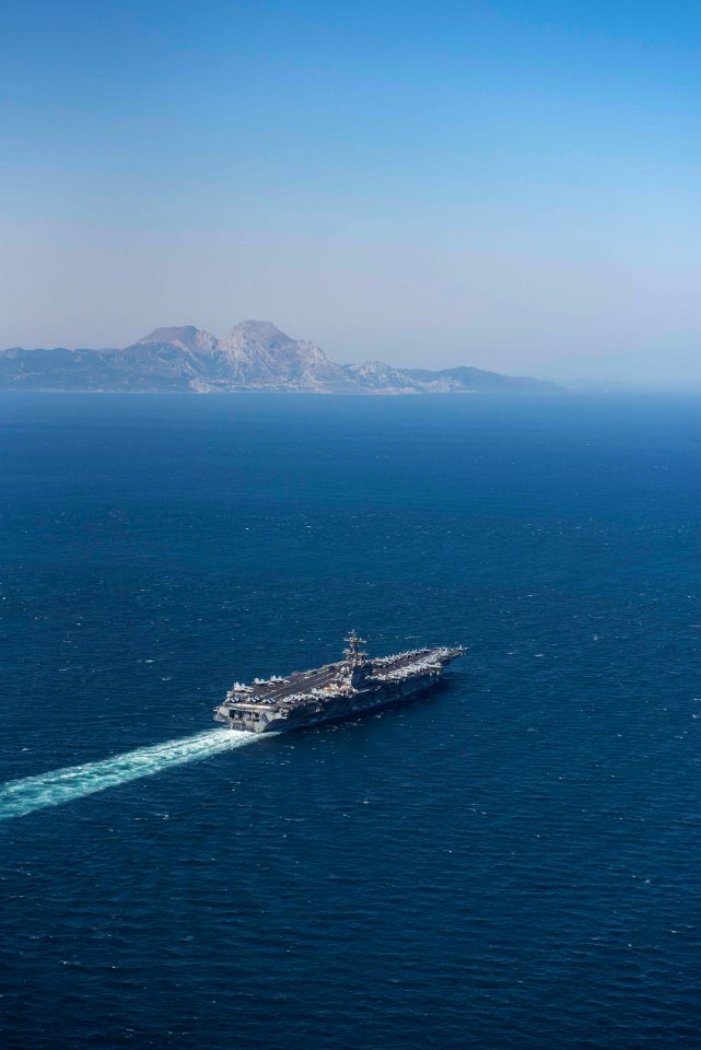 The ship and its carrier strike group are conducting naval…