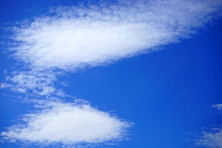 Blue white clouds form photo