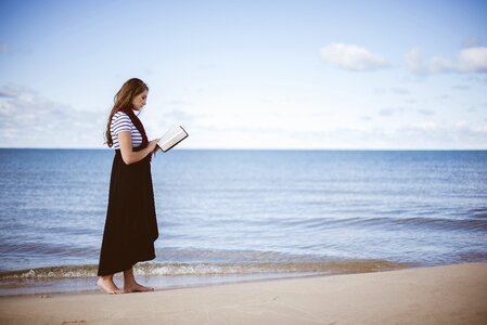 Person reading sand photo
