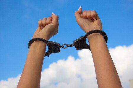 Manicure being shackled by handcuffs freedom