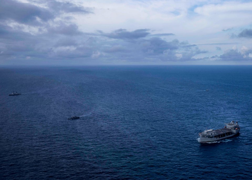 USS Hershel “Woody” Williams conducts fleet maneuvers with…