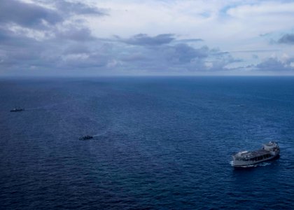 USS Hershel “Woody” Williams conducts fleet maneuvers with…