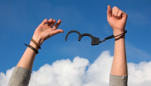Handcuffs clouds man photo