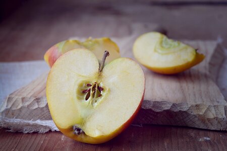 Cut in half halved apples cutting board