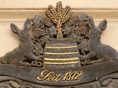 Advertising sign wrought ironwork inn photo