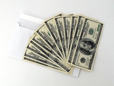 Corruption bribe 100 dollars photo