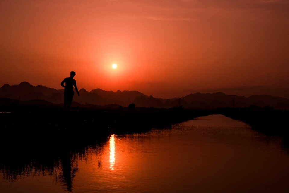 Hunter under sunset