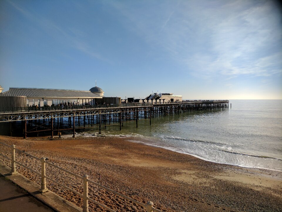 Sand sea hastings pier photo