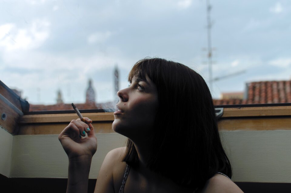 Person smoking woman