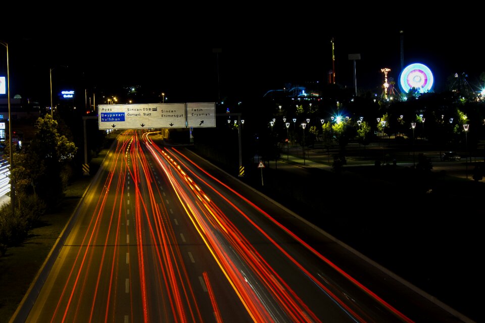 Long-exposure highway black car