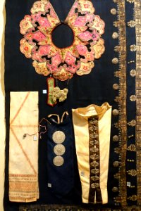 1_Robe_collar_with_unicorn,_Tay,_2_Silver_bra_inlays,_Dao_Tien,_3_Silver_dress_inlays,_Thai,_5_Turban_ornaments,_Cham_Hroi,_6_Shawl,_Lo_Lo_-_Vietnam_National_Museum_of_Fine_Arts_-_Hanoi,_Vietnam_-_DSC05236