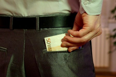 12_-_Corruption_-_euro_notes_in_back_pocket_with_hand_-_royalty_free,_without_copyright,_public_domain_photo_image