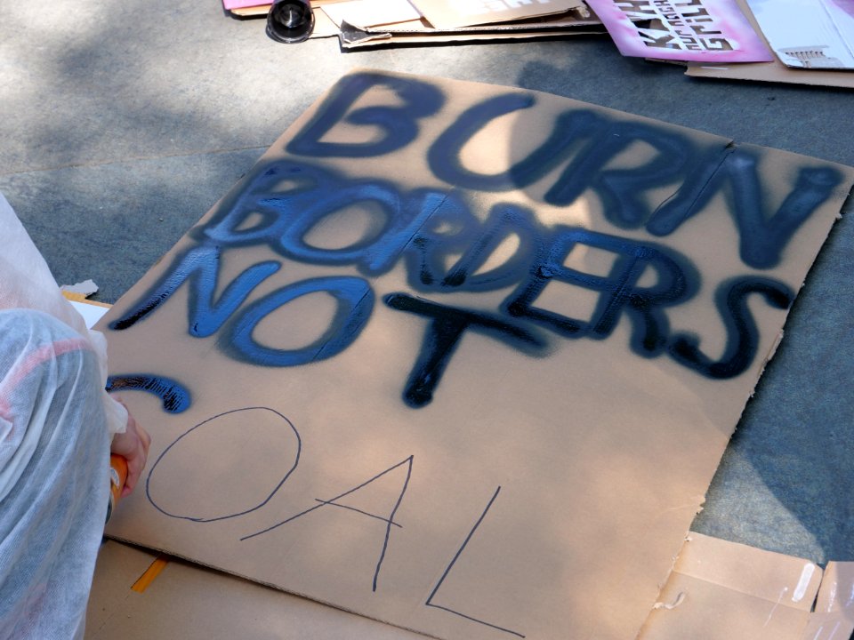 "Burn_borders_not_coal"_poster