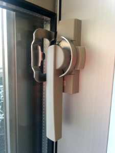 "YKK_AP"_lock_on_a_Japanese_balcony_door,_showing_all_positions_-_4 photo