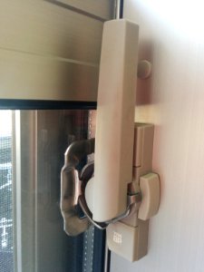 "YKK_AP"_lock_on_a_Japanese_balcony_door,_showing_all_positions_-_1