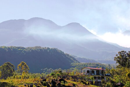 Clouds volcanoes forest photo