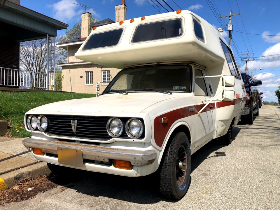 1977_Toyota_Truck_with_Chinook_camper,_front_right,_4-11-2021