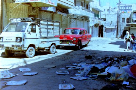 1995_Aleppo_Syria._Trash_in_Sleepy_Street_+_Chevrolet_+_Suzuki._Spielvogel_Archiv