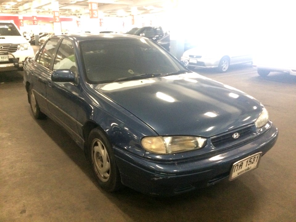 1993-1994_Hyundai_Elantra_(J1)_1.8_GT_Sedan_(12-08-2018)_01