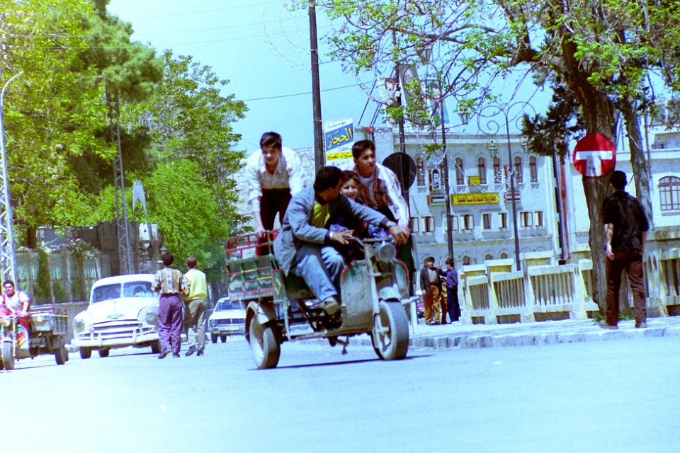 1996_in_Aleppo,_Syria._Four_men_on_a_tricycle._Spielvogel_Archiv