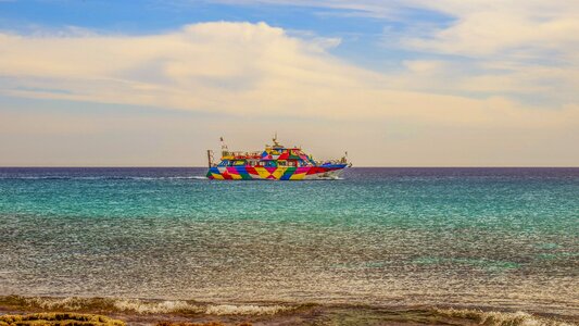 Colorful cruise boat vessel photo