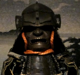 17th_century_iron_kawari_bachi_helmet_from_Japan._Fukikaeshi_are_pierced_with_the_Chinese_character_for_peregrine_falcon