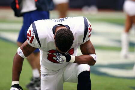 Praying sport american photo