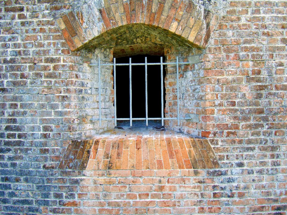 Barred window brick wall fort pickens