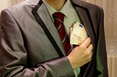 4_-_corruption_-_man_in_suit_-_euro_banknotes_hidden_in_left_jacket_inside_pocket_-_royalty_free,_without_copyright,_public_domain_photo_image photo