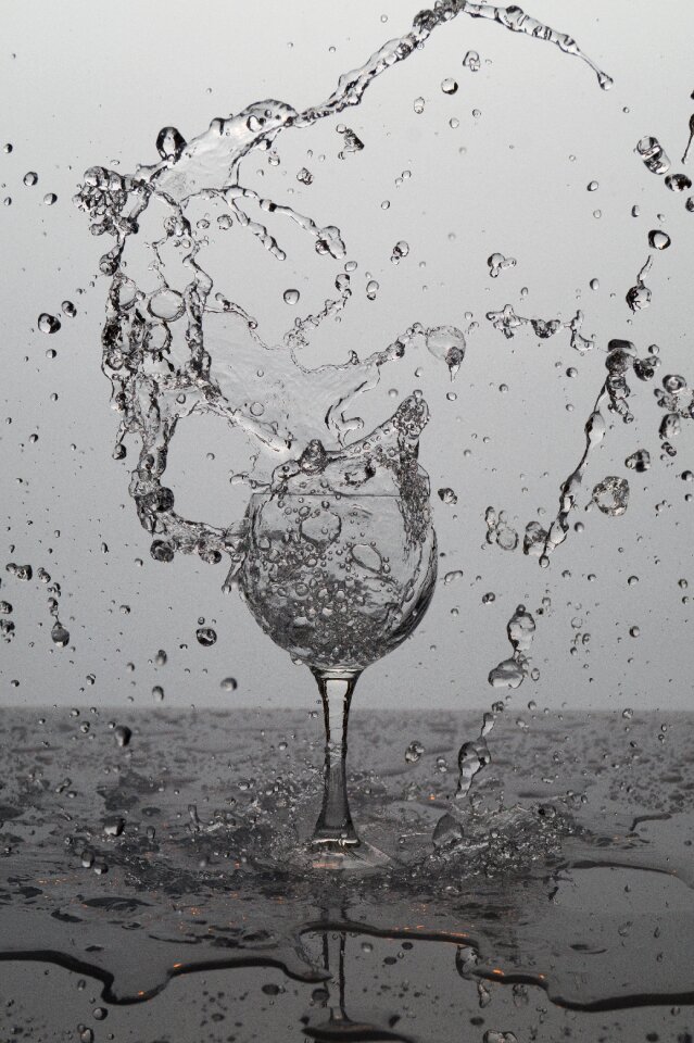 Water bubbles spray wine glass