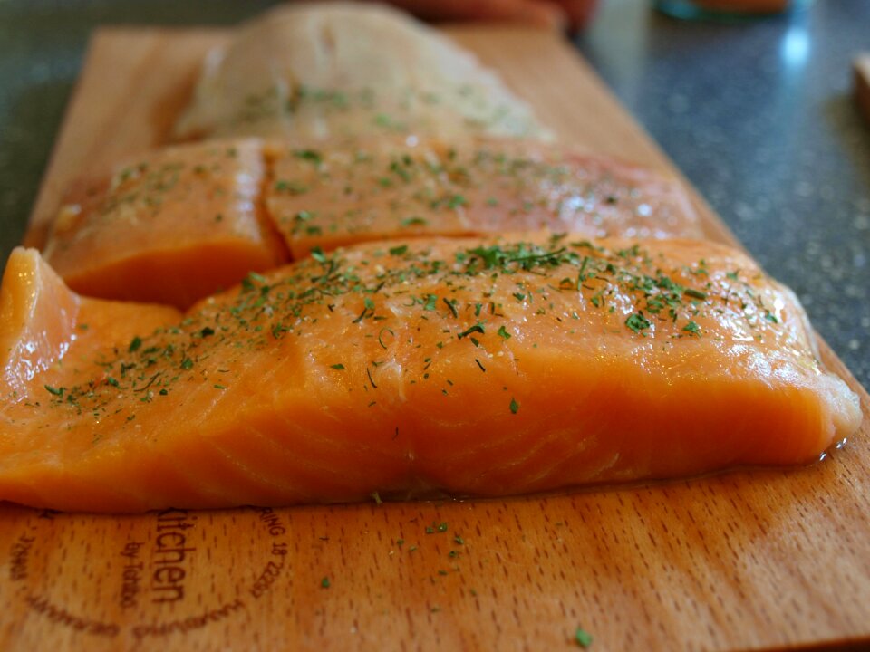 Fish salmon on wooden board grilling fish