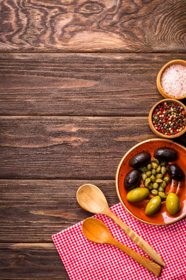 Olives wooden background cooking