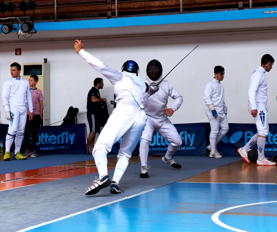2nd_Leonidas_Pirgos_Fencing_Tournament._The_fencer_Lampros_Dimitropoulos_performs_a_flèche_and_is_about_to_score_a_touch