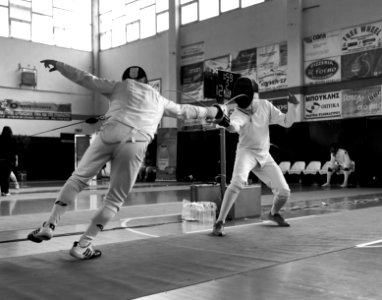 2nd_Leonidas_Pirgos_Fencing_Tournament._The_fencer_on_the_left_extends_his_arm_and_scores_a_touch