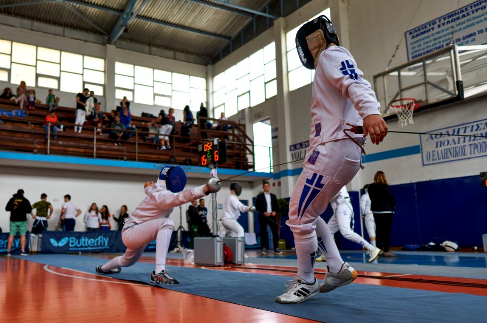 2nd_Leonidas_Pirgos_Fencing_Tournament._Deep_lunge_from_the_fencer_on_the_left,_displacement_from_the_fencer_on_the_right